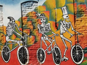 South American artwork tends to be vibrant and colourful, often featuring skeletons and skulls as a pervasive theme. 