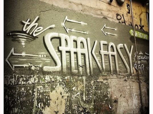 the speakeasy written on wall