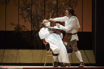 Renato Girolami as Doctor Bartolo and Joshua Hopkins as Figaro in the Canadian Opera Company production of The Barber of Seville, 2015. Conductor Rory Macdonald, director Joan Font, set and costume designer Joan Guillén, choreographer Xevi Dorca and lighting designer Albert Faura. Photo: Michael Cooper