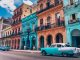 Havana Chronicles. TheSceneinTO.com Visiting Havana. Old Car in front of bueatiful old buildings, Old Havana.